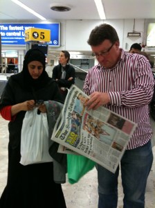 Baggage reclaim at Heathrow: Anjum & Chris re-entering UK life