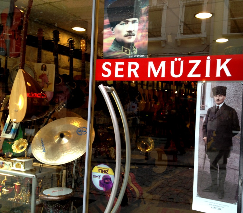 Turkey's hero founder Attaturk on the door of a music shop.
